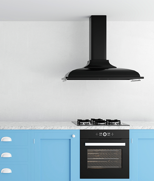 Black range hood, specifically a Krona kitchen hood, installed above an induction cooktop and oven unit