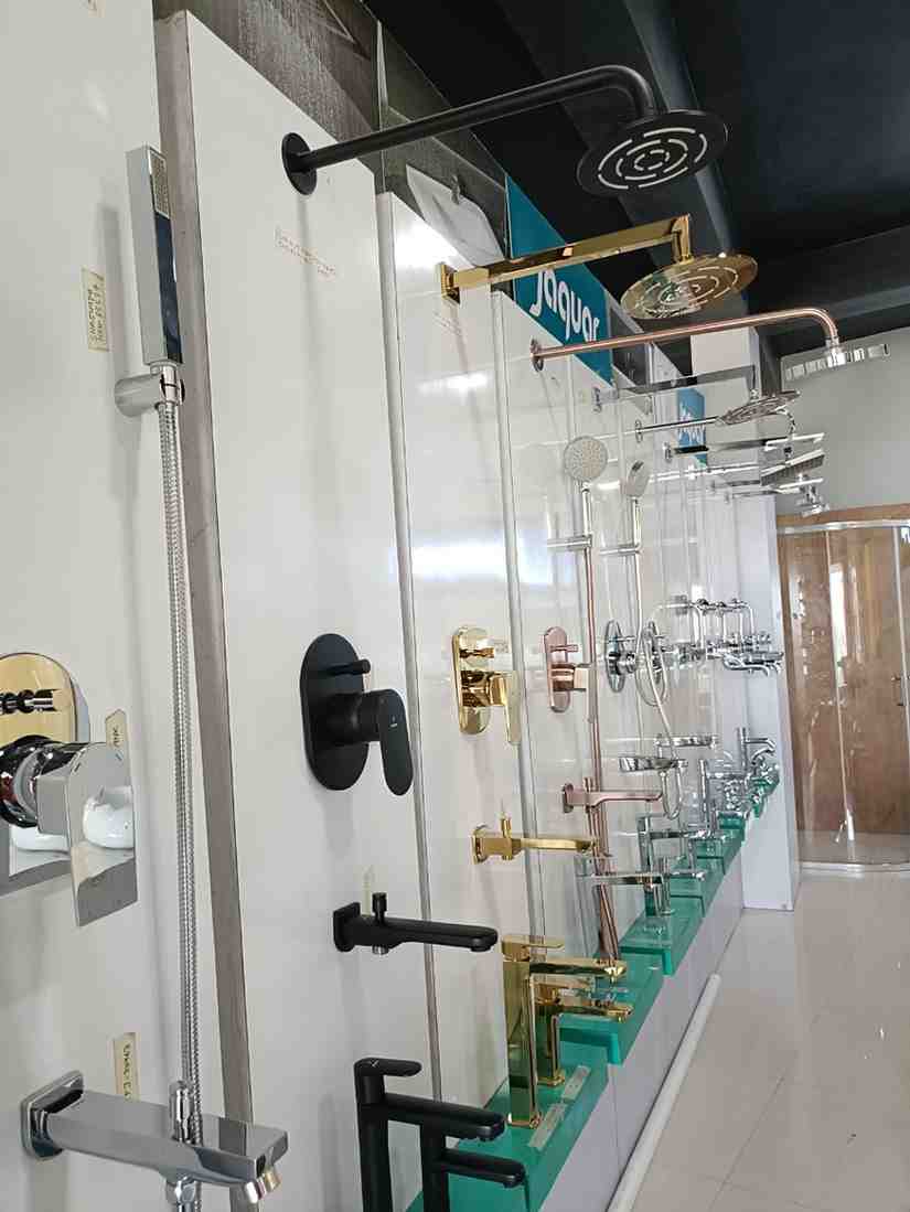 Shower heads and other bathroom fittings, likely in a showroom or retail store
