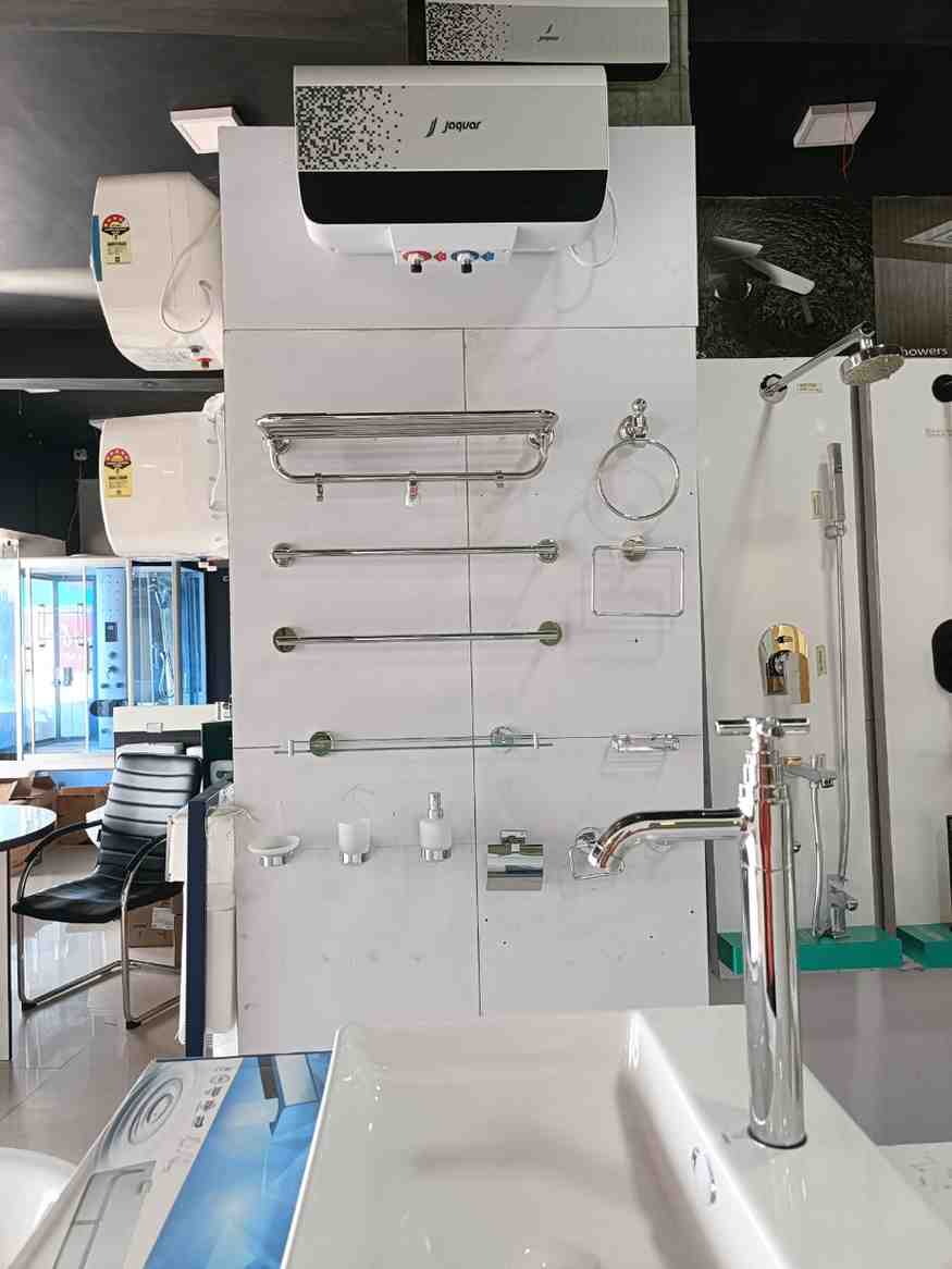 Bathroom hardware and a water heater, likely from a brand like Jaquar, as indicated on the water heater itself