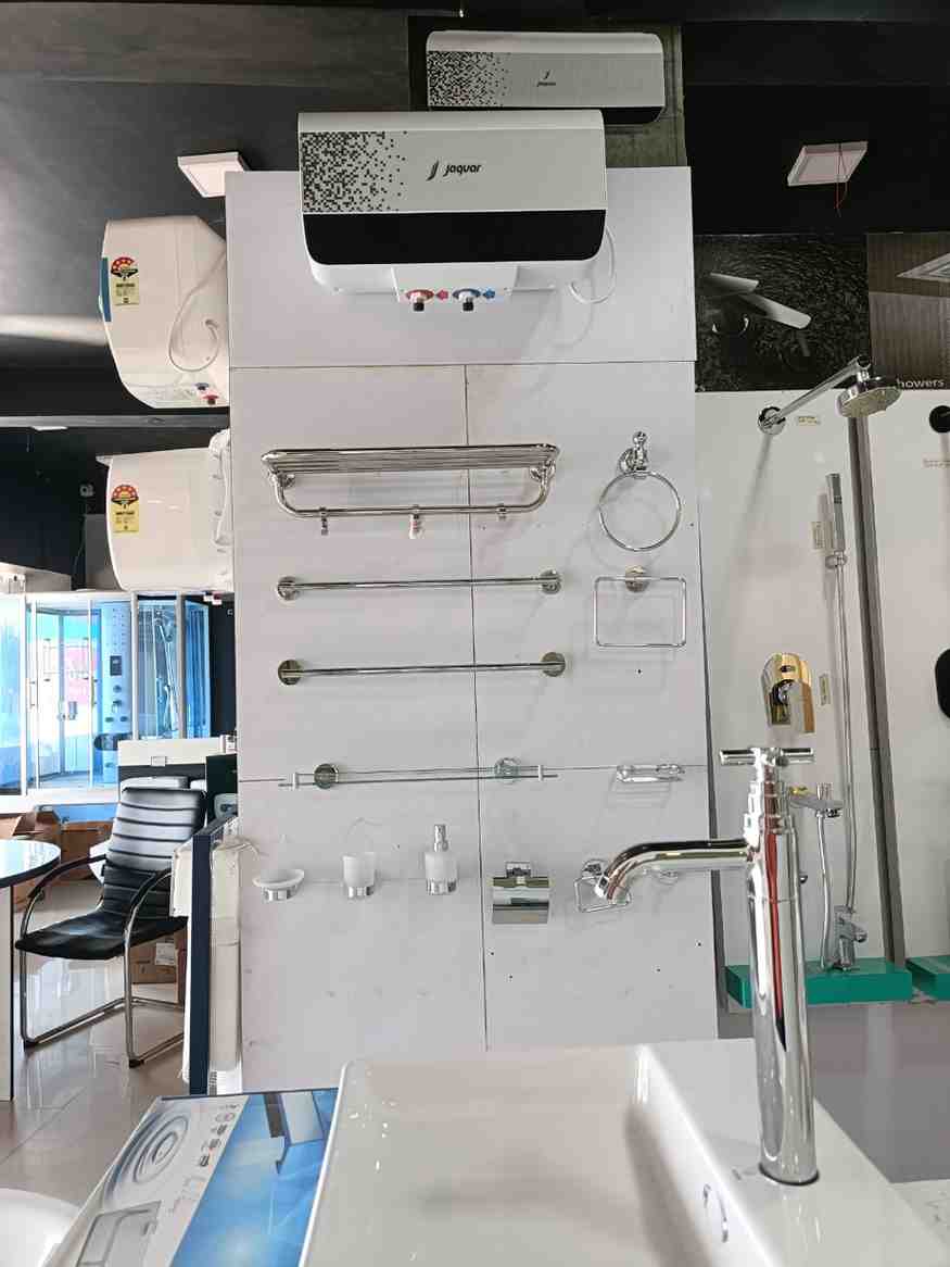 Bathroom hardware and a water heater, likely from a brand like Jaquar, as indicated on the water heater itself