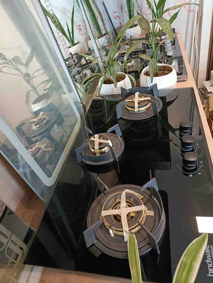 Hindware gas hob with multiple burners, likely a built-in model, given the design and the visible